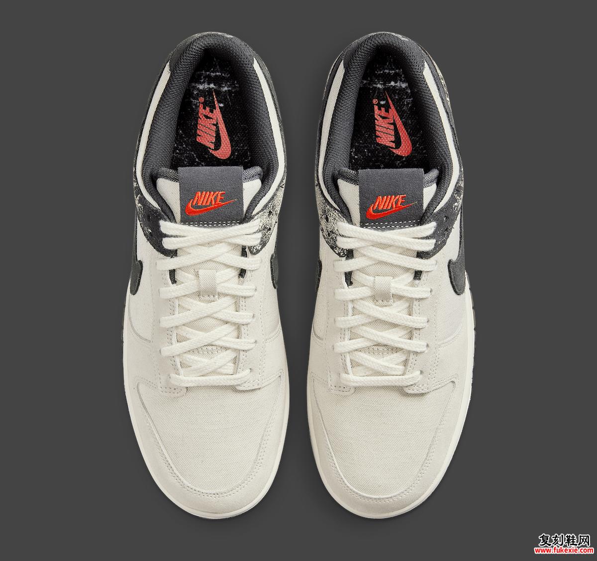 Nike Dunk Low Pale Ivory Off Noir 的俯视图，突出了红色的 Nike 舌头品牌。