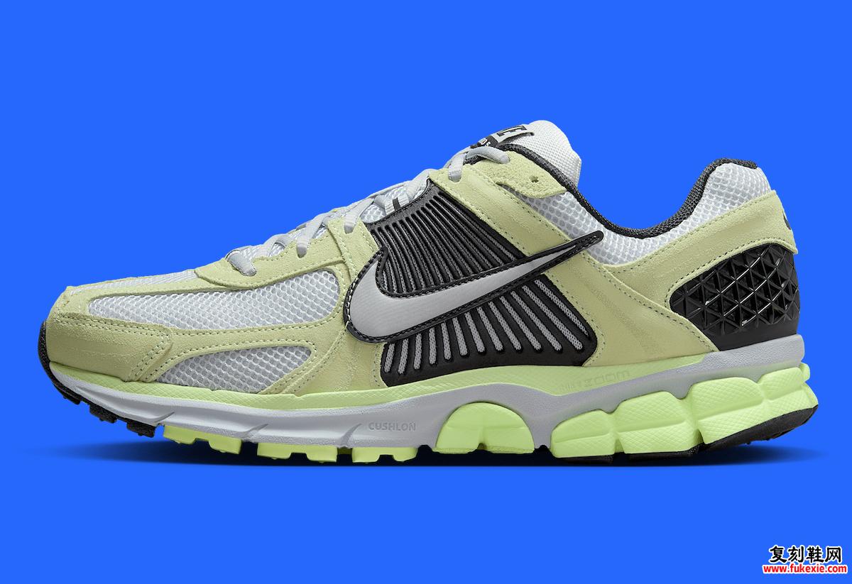 Nike Zoom Vomero 5 Barely Volt 的侧视图，突出了灰色的轮廓笼和 Swoosh 标志。