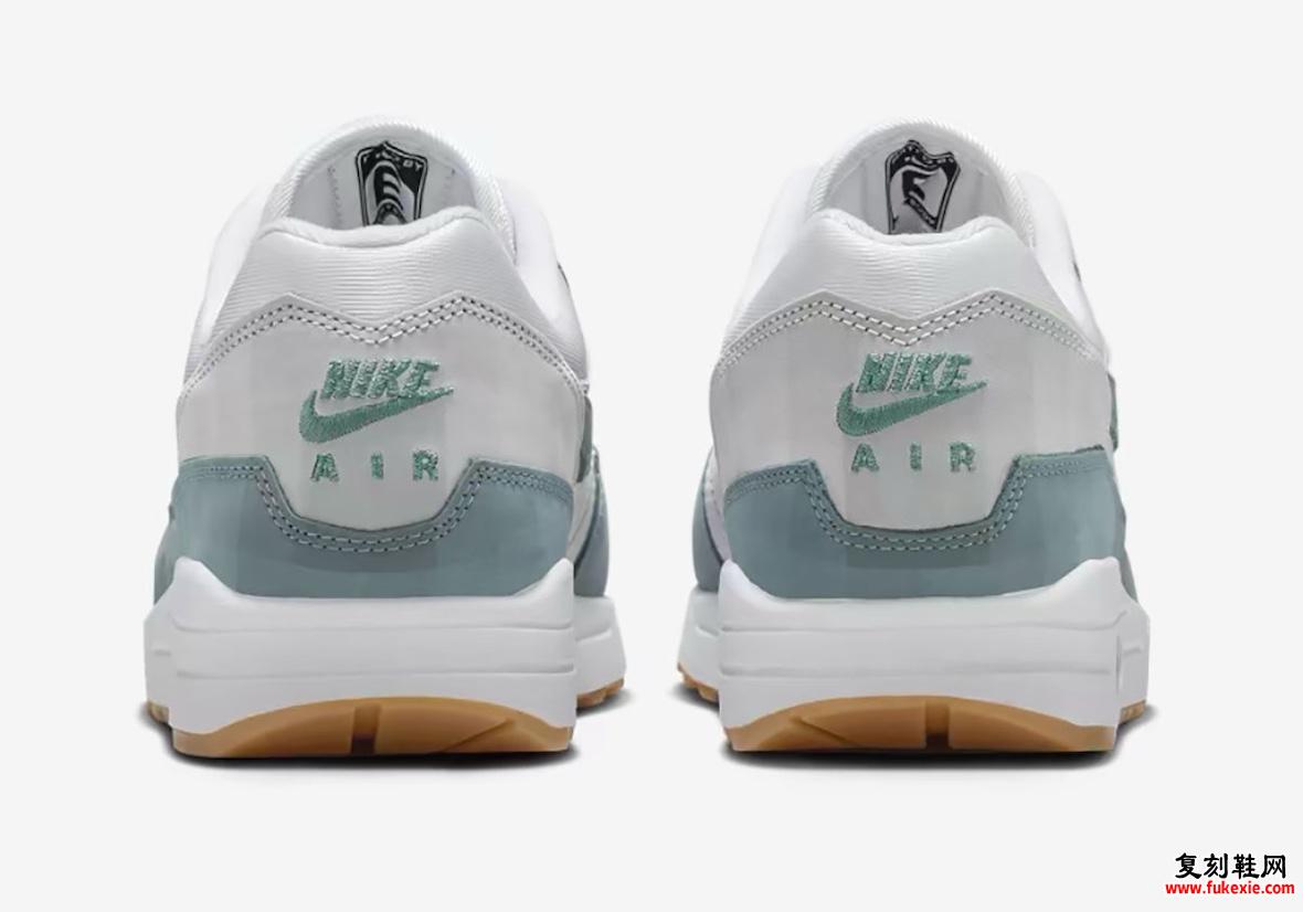 Nike Air Max 1 Low Poly Adventure 后视图，以绿色刺绣展示 Nike Air 品牌标识