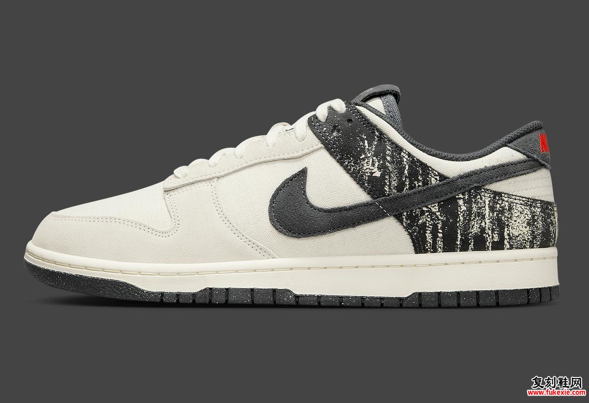 Nike Dunk Low Pale Ivory Off Noir 的侧面轮廓，搭配黑色 Swoosh 标志和斑点外底。