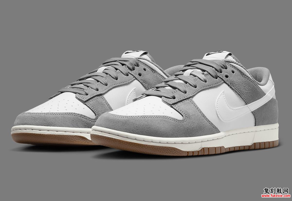 Nike Dunk Low “Grey Suede” 的侧面视图，展示了其白色皮革底座和灰色绒面革覆层